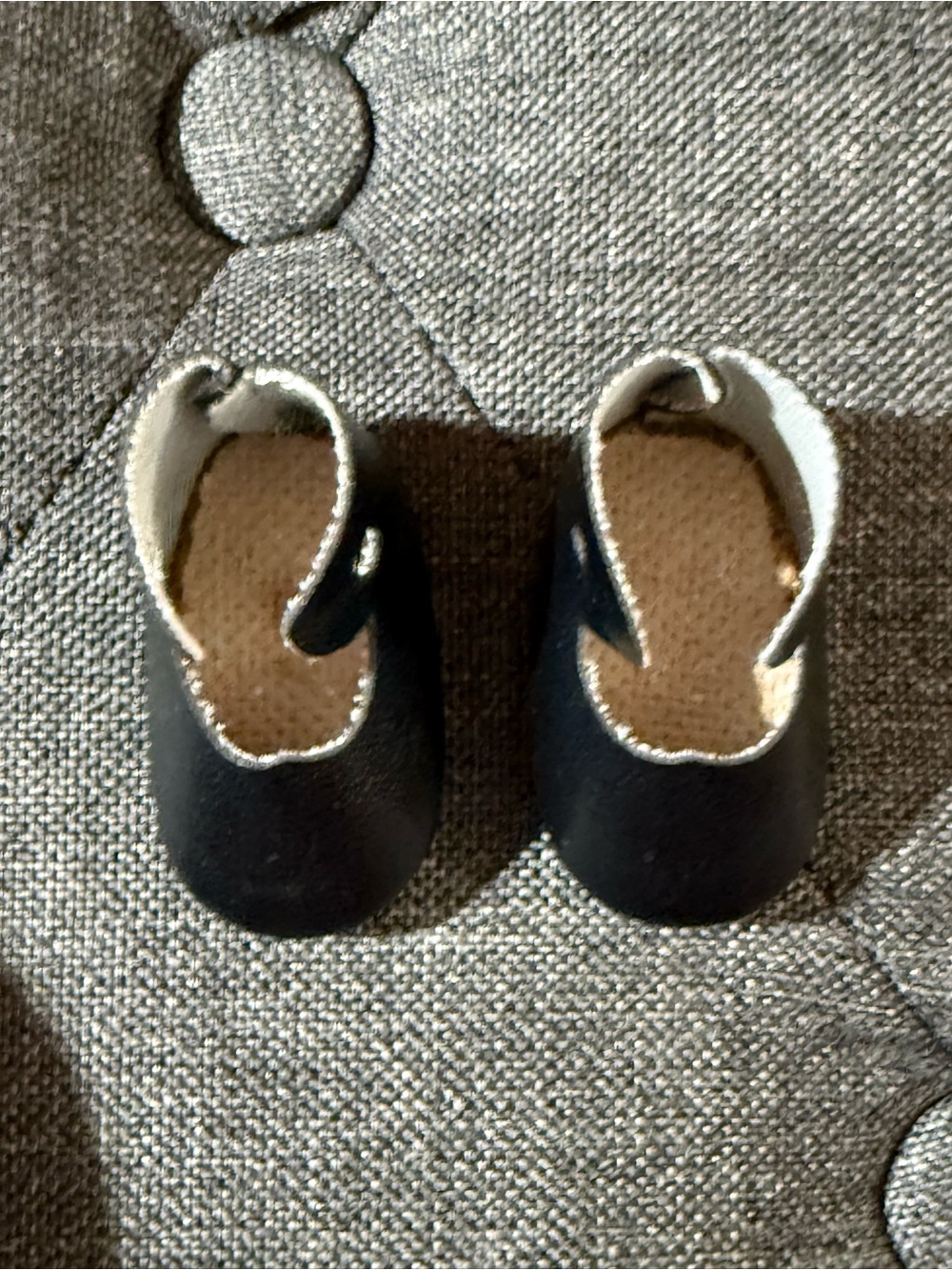 Tiny black doll shoes